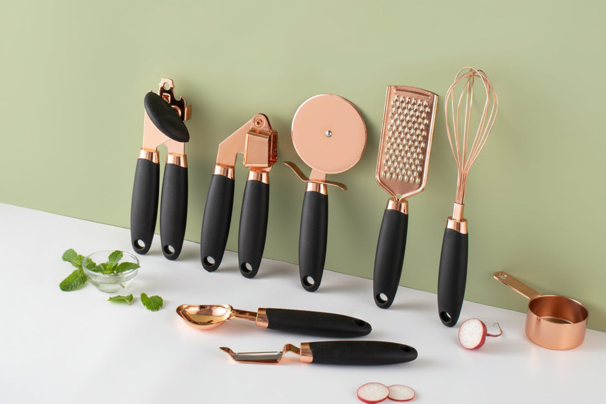 7-piece kitchen tool set with rose gold and black handles on a white surface with a green background.