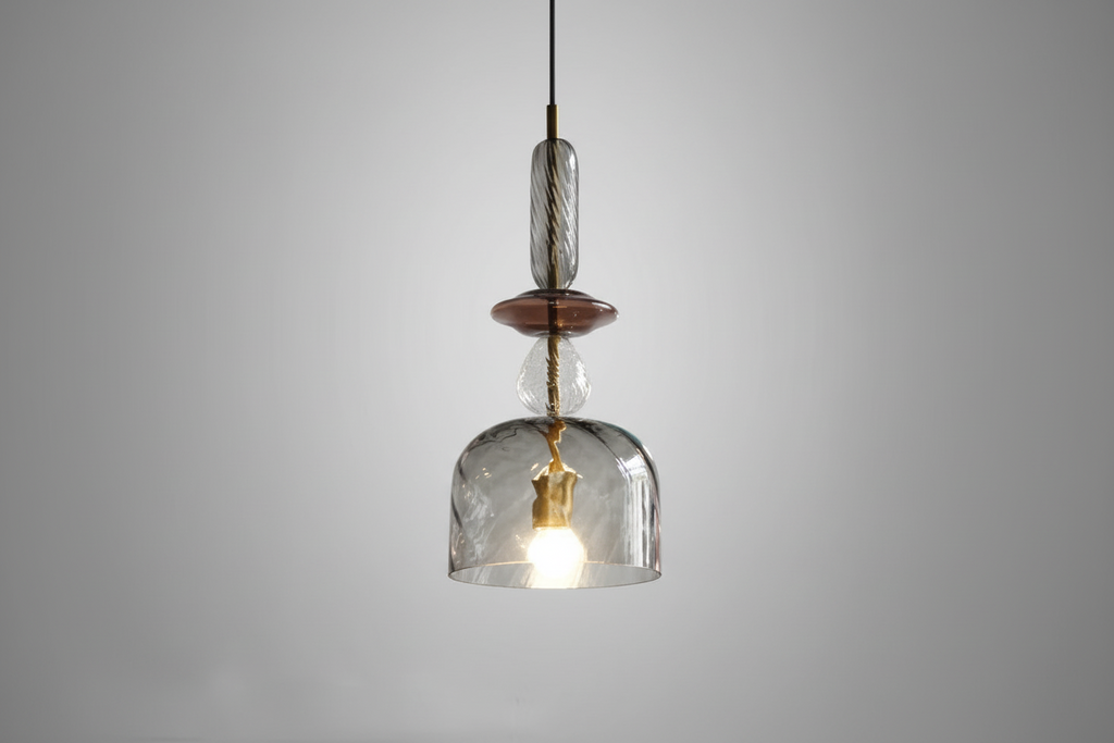 Clear glass pendant light with wooden accent on a gray background