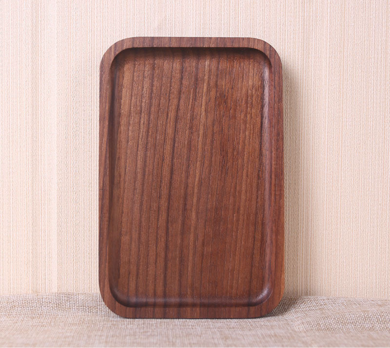 Wooden tray on a textured surface with a neutral background