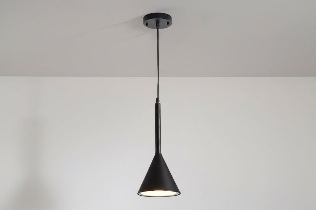 Black pendant light hanging against a plain white background