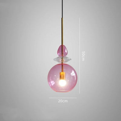 Pink glass pendant light with measurements on a gray background