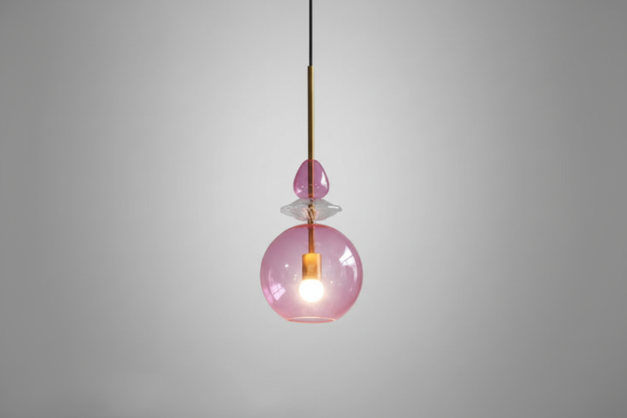 Pink glass pendant light on a gray background