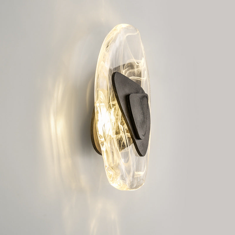 Wall-mounted light fixture with a modern design on a gray background