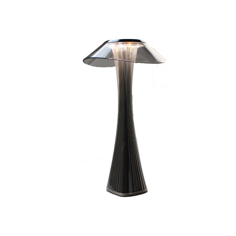 Modern black table lamp with a unique design on a white background