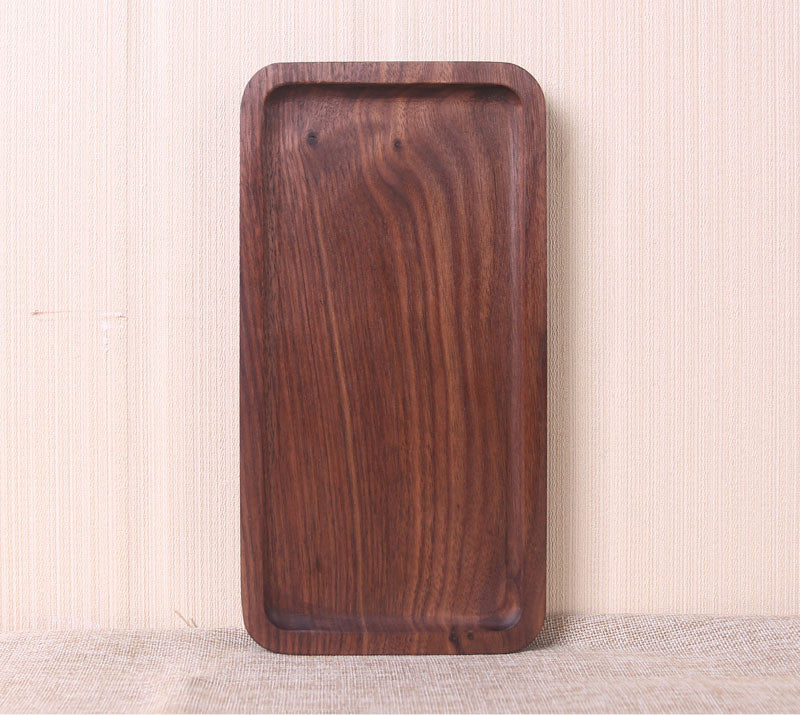 Wooden tray on a textured surface with a neutral background