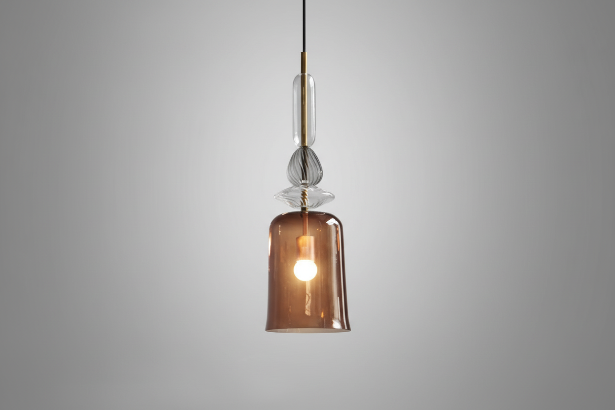 Modern pendant light with a brown glass shade on a gray background