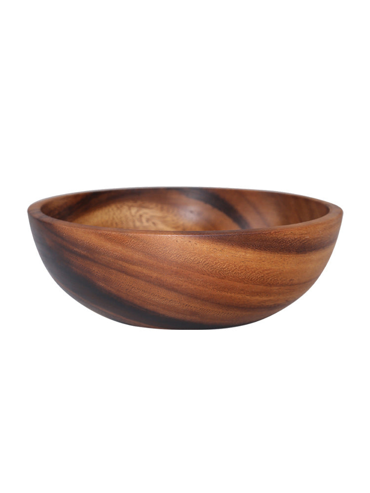Wooden bowl with a striped pattern on a white background