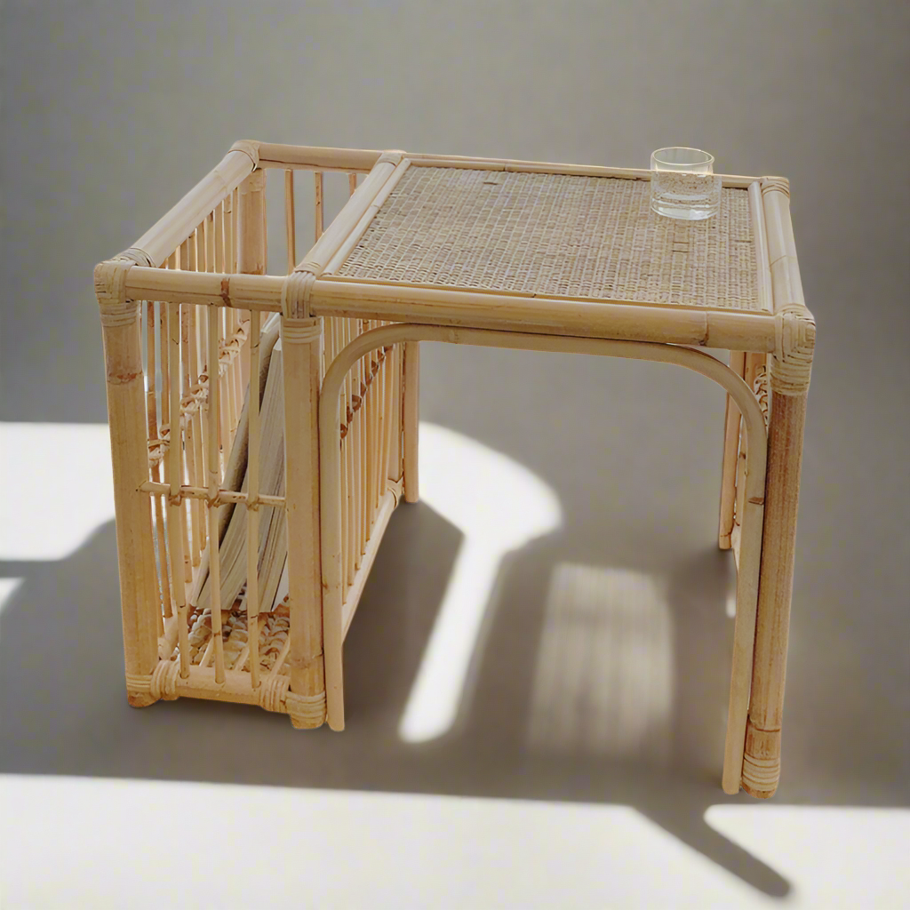 Bamboo side table with a glass on a neutral background
