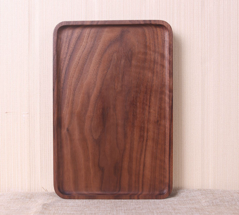 Wooden tray on a textured surface with a neutral background
