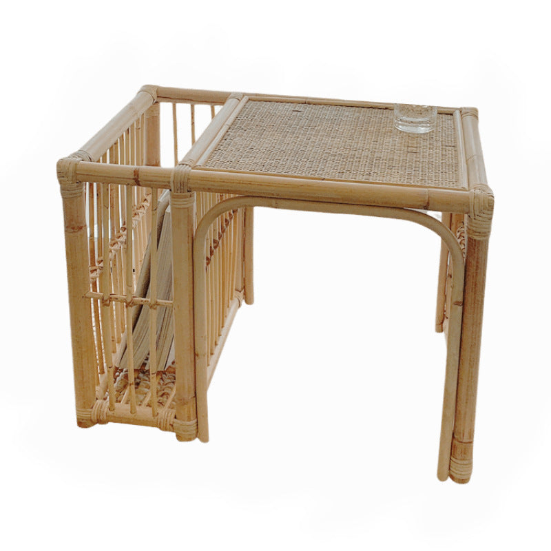Wicker side table with a small stool on a white background