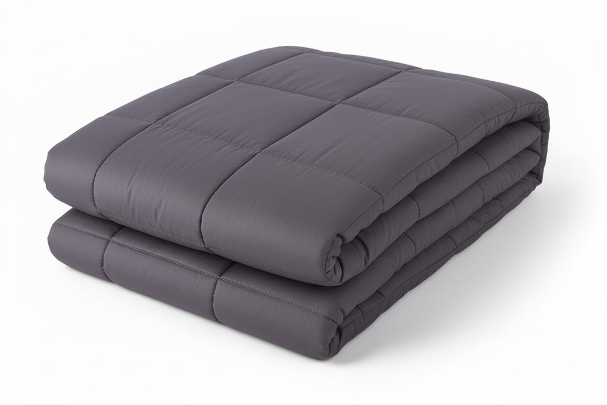 Folded gray weighted blanket on a white background
