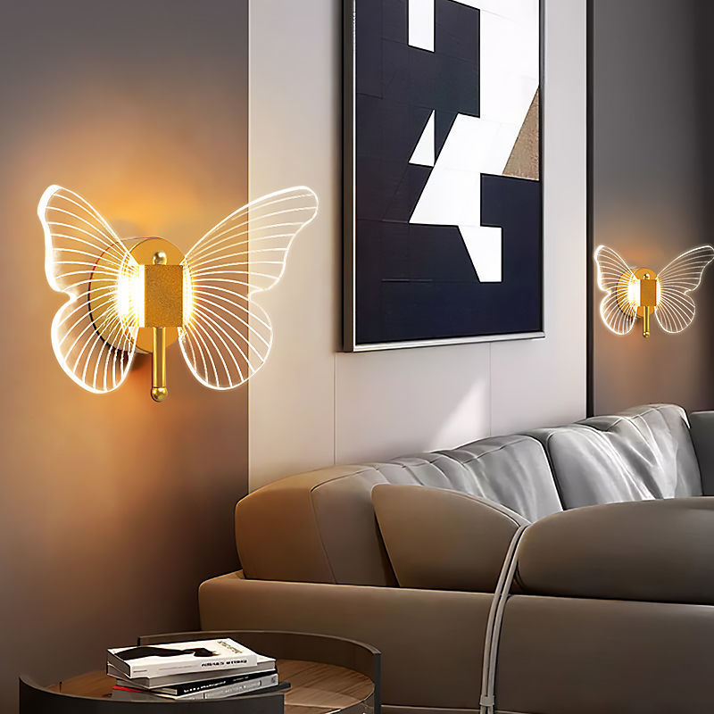Butterfly wall lights in a living room setting with a couch and abstract art.