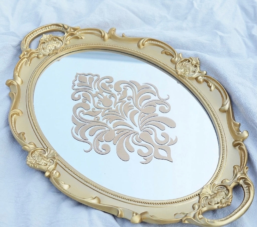 Decorative gold frame with intricate patterns on a light blue background