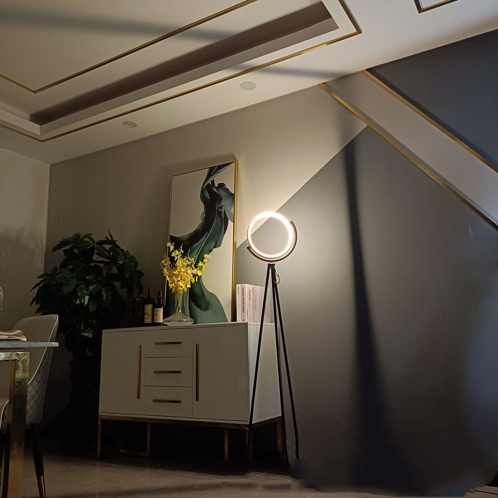 Modern interior with a lamp, cabinet, and decorative elements.
