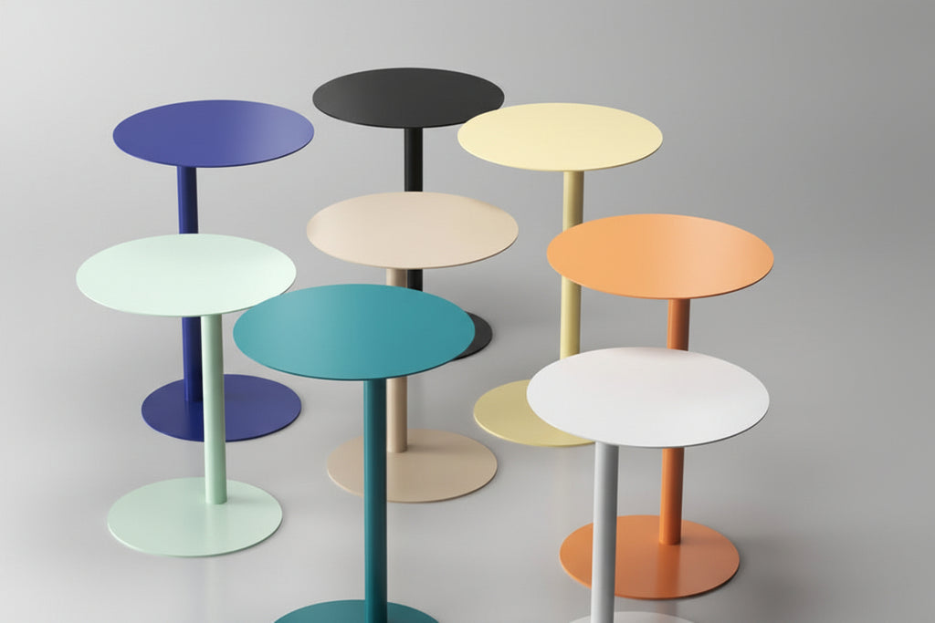 Set of colorful round side tables on a gray background